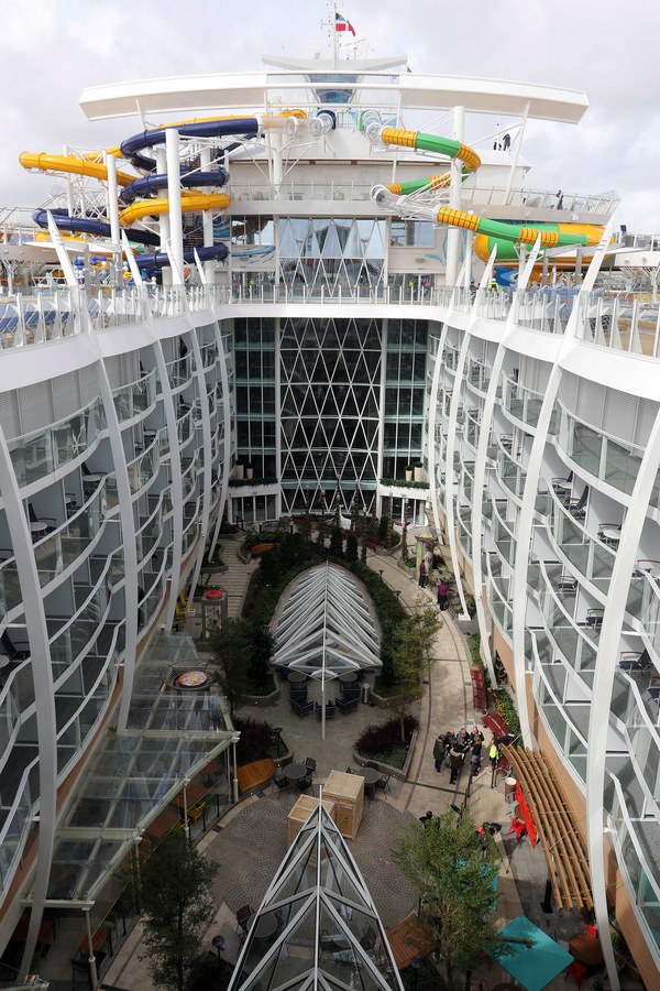 epa06624356 A view from a deck towards the central park aboard the cruise ship 'Symphony of the Seas' as final works are done on the Oasis-class ship in the port of St.-Nazaire, France, 23 March 2018. The The Royal Caribbean Cruise Line ship had let the Bahamas registered cruise ship built at the STX France shipyards in Saint-Nazaire is the world's largest cruise ship. With a length of 361 meters, a width of 65.7 meters and 228.081 tonnes it can carry up to 6.870 passengers and will take the title of the world's largest cruise ship from her sister cruiser 'Harmony of the Seas' when finally finished. EPA/EDDY LEMAISTRE