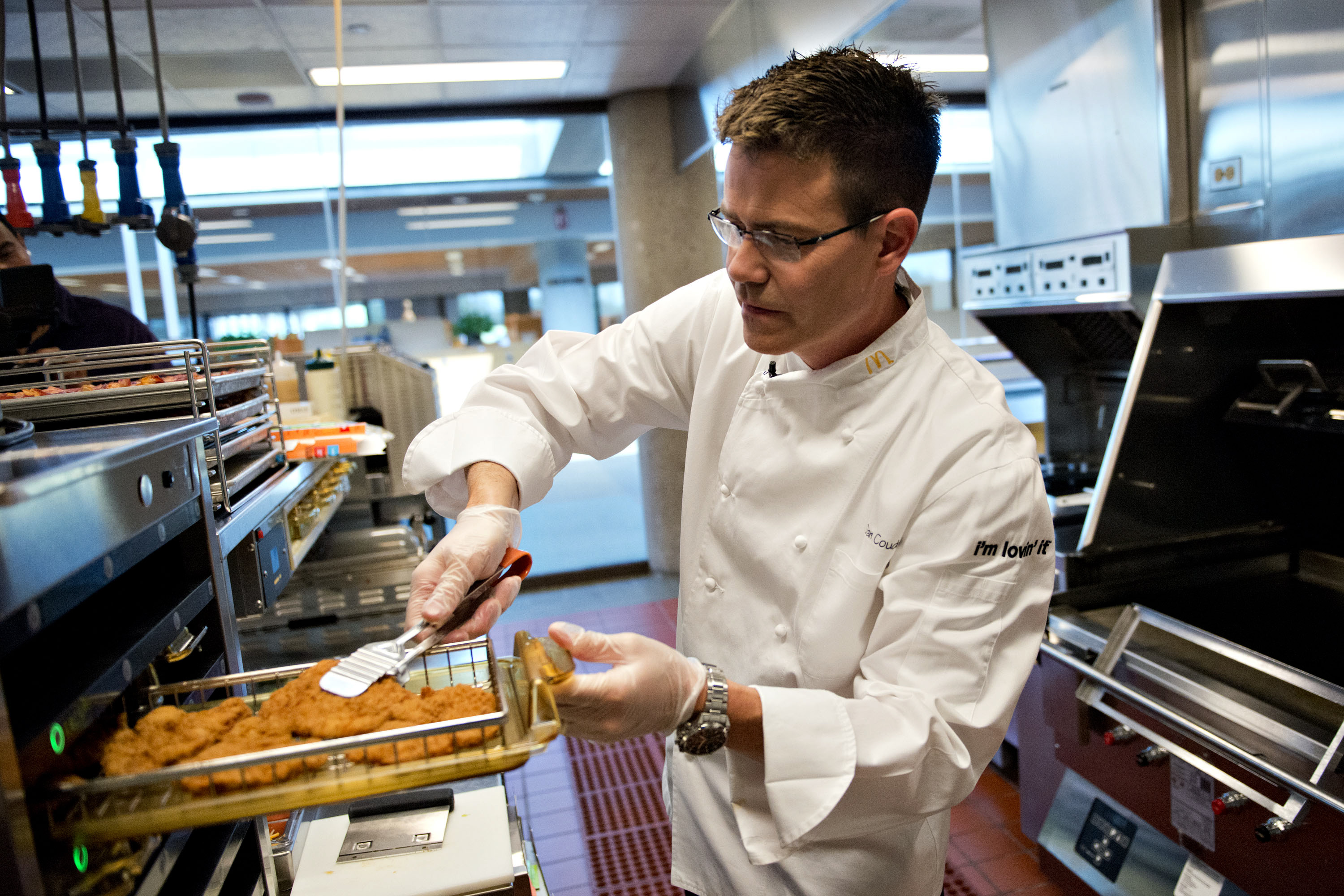 Dan Coudreaut, executive chef and director of culinary innovation for McDonald's Corp., prepares a McWrap in a test kitchen at McDonald's headquarters in Oak Brook, Illinois, U.S., on Tuesday, July 23, 2013. Coudreaut graduated from the Culinary Institute of America at the top of his class, ran the kitchen at the Four Seasons Resort and Club in Dallas and joined McDonalds in 2004. Photographer: Daniel Acker/Bloomberg via Getty Images