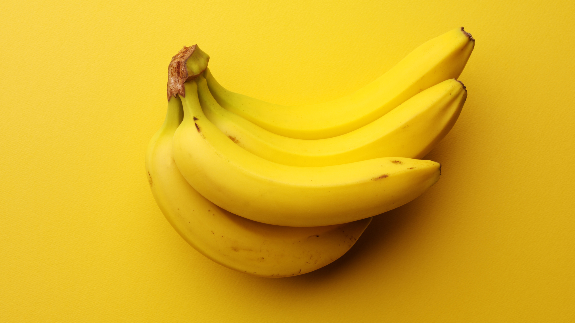 Bananas on a yellow background.