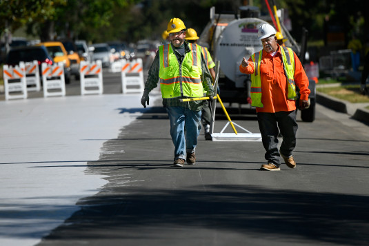 Jordan Avenue, north of Hart Street is getting a new surface coating similar to slurry seal. However, instead of traditional black asphalt, this coat is a concrete color designed to reflect heat. This is the first such installation on a public street in the State of California. Canoga Park., CA. 5/20/2017 Photo by John McCoy/Los Angeles Daily News (SCNG)