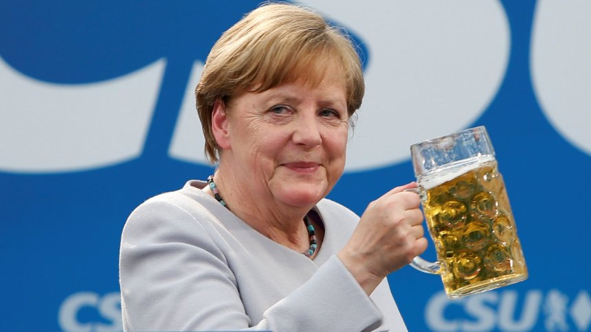 German Chancellor and head of the Christian Democratic Union (CDU) Angela Merkel toasts during the Trudering festival in Munich, Germany, May 28, 2017.    REUTERS/Michaela Rehle