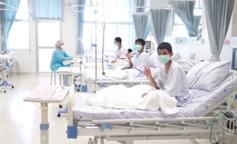 A screen grab shows boys rescued from the Thai cave wearing mask and resting in a hospital in Chiang Rai, Thailand from a July 11, 2018 handout video.    Government Public Relations Department (PRD) and Government Spokesman Bureau/Handout via REUTERS TV    ATTENTION EDITORS - THIS IMAGE HAS BEEN SUPPLIED BY A THIRD PARTY. NO RESALES. NO ARCHIVES.  MANDATORY CREDIT  TPX IMAGES OF THE DAY