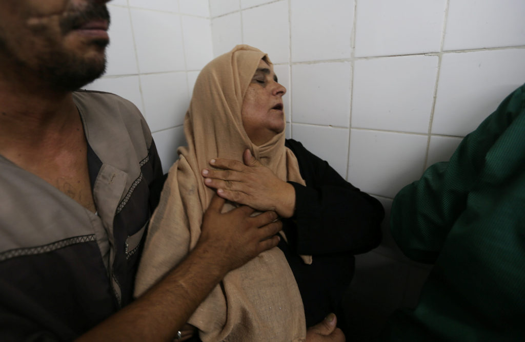 The mother of a Palestinian who was killed by Israeli troops east of Khan Younis, reacts at hospital in Gaza Strip July 20, 2018. REUTERS/Ibraheem Abu Mustafa
