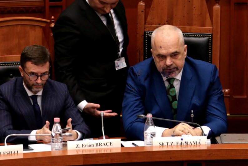 Albania's Prime Minister Edi Rama looks on after liquid substance was thrown at him by members of the opposition during parliamentary session in Tirana, Albania, February 14, 2019. REUTERS/Florion Goga