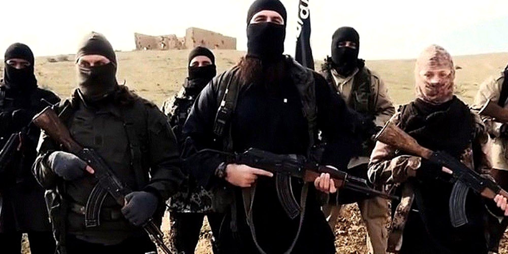 Mandatory Credit: Photo by REX USA (2642870a)  Hayat Boumeddiene, far right  Hayat Boumeddiene 'appears in Islamic State film' - 06 Feb 2015  The latest video released by French-speaking Islamic state (ISIS), fighters may be Hayat Boumeddiene, who is believed to have knowledge about the deadly January 9, 2015 attack on a Paris kosher grocery,The video, titled "Blow Up France 2," was released Tuesday and shows an ISIS fighter praising previous attackers in France and calling for new attacks. The video shows a woman standing next to the speaker, wearing camouflage clothing and holding a weapon. French authorities are investigating the possibility this woman could be Hayat Boumeddiene. Her husband, Amedy Coulibaly, killed four hostages January 9 at a kosher grocery in Paris, authorities said. He was killed by police in a rescue and the remaining hostages fled to safety.