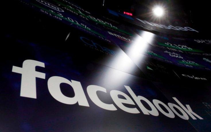 FILE- In this March 29, 2018, file photo, the logo for Facebook appears on screens at the Nasdaq MarketSite in New York's Times Square. Facebook reports earnings Wednesday, April 25. (AP Photo/Richard Drew, File)