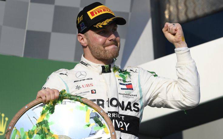 Mercedes driver Valtteri Bottas of Finland celebrates after winning the Australian Formula 1 Grand Prix in Melbourne, Australia, Sunday, March 17, 2019. Bottas won ahead of teammate Lewis Hamilton of Britain while Red Bull driver Max Verstappen of the Netherlands placed third. (AP Photo/Andy Brownbill)