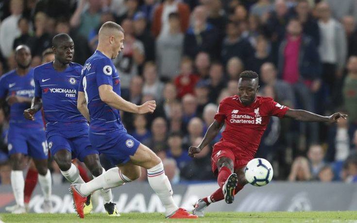 Liverpool's Naby Keita, right, kicks the ball during the English Premier League soccer match between Chelsea and Liverpool at Stamford Bridge stadium in London, Saturday, Sept. 29, 2018. (AP Photo/Frank Augstein)