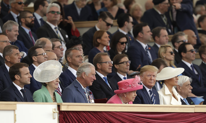 French President Emmanuel Macron, British Prime Minister Theresa May, Britain's Prince Charles, Queen Elizabeth II, President Donald Trump and first lady Melania Trump, from left, attend an event to mark the 75th anniversary of D-Day in Portsmouth, England Wednesday, June 5, 2019. World leaders including U.S. President Donald Trump are gathering Wednesday on the south coast of England to mark the 75th anniversary of the D-Day landings. (AP Photo/Matt Dunham)