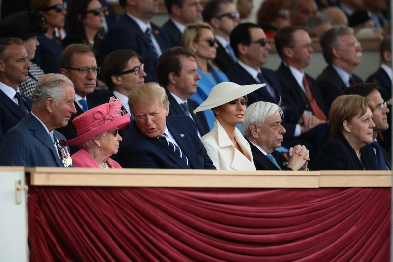 PORTSMOUTH, ENGLAND - JUNE 05: President of the United States, Donald Trump and First Lady of the United States, Melania Trump sit next to Prince Charles, Prince of Wales, (L) Queen Elizabeth II, President of Greece, Prokopis Pavlopoulos (2nd R) and Chancellor of Germany, Angela Merkel (R) as they attend the D-Day Commemorations on June 5, 2019 in Portsmouth, England. The political heads of 16 countries involved in World War II joined Her Majesty, The Queen on the UK south coast for a service to commemorate the 75th anniversary of D-Day. Overnight it was announced that all 16 had signed a historic proclamation of peace to ensure the horrors of the Second World War are never repeated. The text has been agreed by Australia, Belgium, Canada, Czech Republic, Denmark, France, Germany, Greece, Luxembourg, Netherlands, Norway, New Zealand, Poland, Slovakia, the United Kingdom and the United States of America. (Photo by Dan Kitwood/Getty Images)