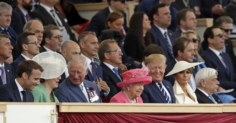 French President Emmanuel Macron, British Prime Minister Theresa May, Britain's Prince Charles, Queen Elizabeth II, President Donald Trump and first lady Melania Trump, from left, attend an event to mark the 75th anniversary of D-Day in Portsmouth, England Wednesday, June 5, 2019. World leaders including U.S. President Donald Trump are gathering Wednesday on the south coast of England to mark the 75th anniversary of the D-Day landings. (AP Photo/Matt Dunham)
