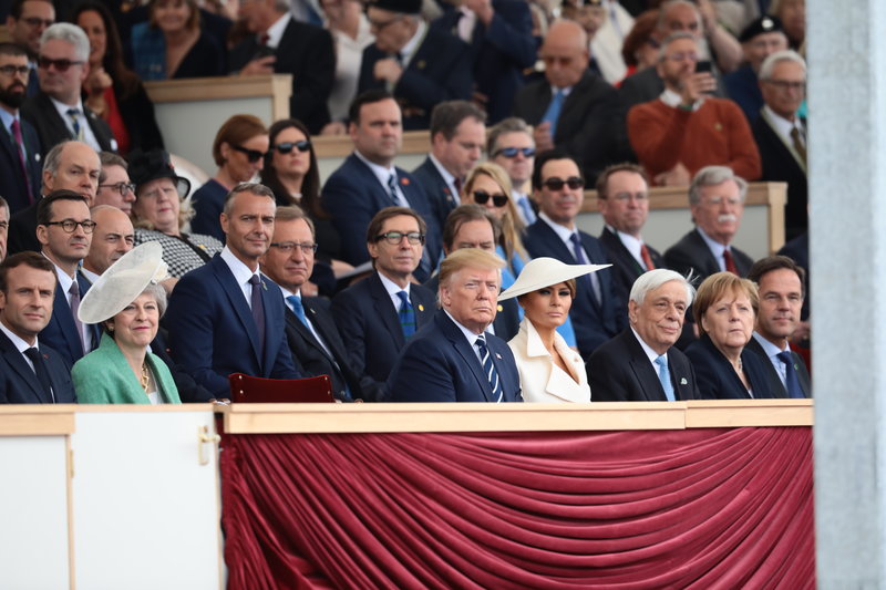PORTSMOUTH, ENGLAND - JUNE 05: President of the United States, Donald Trump and First Lady of the United States, Melania Trump sit next to British Prime minister, Theresa May (L) President of Greece, Prokopis Pavlopoulos (3rd R) and Chancellor of Germany, Angela Merkel (2nd R) and Prime Minister of the Netherlands, Mark Rutte (R) as they attend the D-Day Commemorations on June 5, 2019 in Portsmouth, England. The political heads of 16 countries involved in World War II joined Her Majesty, The Queen on the UK south coast for a service to commemorate the 75th anniversary of D-Day. Overnight it was announced that all 16 had signed a historic proclamation of peace to ensure the horrors of the Second World War are never repeated. The text has been agreed by Australia, Belgium, Canada, Czech Republic, Denmark, France, Germany, Greece, Luxembourg, Netherlands, Norway, New Zealand, Poland, Slovakia, the United Kingdom and the United States of America. (Photo by Dan Kitwood/Getty Images)