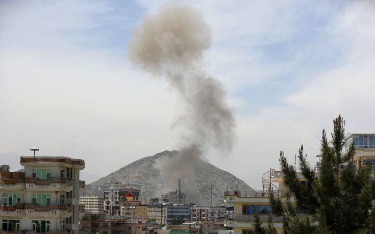 Smokes rises after a huge explosion near the offices of the attorney general in Kabul, Afghanistan, Wednesday, May 8, 2019. Two police officials say Wednesday's explosion was followed by a gunbattle between militants and security forces. (AP Photo/Rahmat Gul)