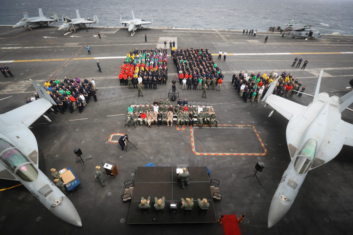Capt. Putnam H. Browne, commanding officer of the aircraft carrier USS Abraham Lincoln speaks  on the flight deck during a change of command ceremony, in the Gulf, in this handout picture released by U.S. Navy on July 29, 2019. Jessica Paulauskas/U.S. Navy/Handout via REUTERS ATTENTION EDITORS- THIS IMAGE HAS BEEN SUPPLIED BY A THIRD PARTY.