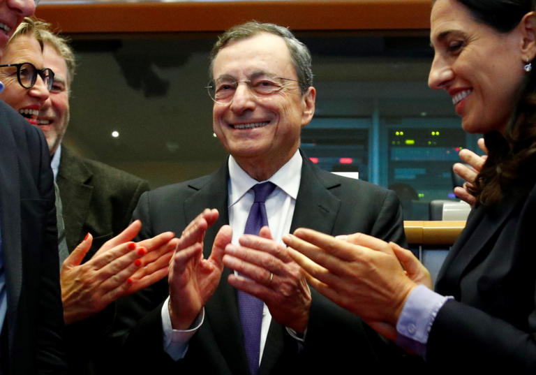 European Central Bank (ECB) President Mario Draghi is applauded by members of the European Parliament's Economic and Monetary Affairs Committee in Brussels, Belgium September 23, 2019. REUTERS/Francois Lenoir