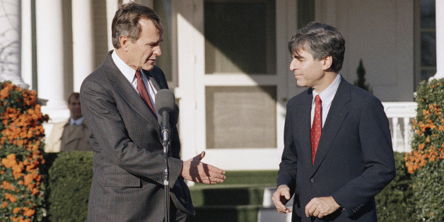 President-elect George Bush offers his hand to Massachusetts Gov. Michael Dukakis after the two met at Bush?s residence in Washington, Friday, Dec. 2, 1988. (AP Photo/Scott Applewhite)