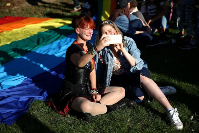 Participants take a selfie as they attend a Pride march in the town of Kalisz, Poland, September 22, 2019. Picture taken on September 22, 2019.  REUTERS/Stoyan Nenov