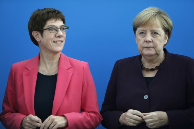 FILE PHOTO: German Defence Minister Annegret Kramp-Karrenbauer and Chancellor Angela Merkel attend the CDU board meeting in Berlin, Germany, October 14, 2019. REUTERS/Michele Tantussi/File Photo