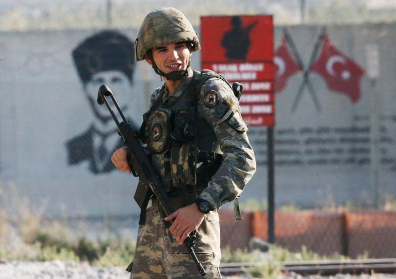 Shortly after the Turkish operation inside Syria had started, a Turkish soldiers stands at the border with Syria in Akcakale, Sanliurfa province, southeastern Turkey, Wednesday, Oct. 9, 2019. Turkey launched a military operation Wednesday against Kurdish fighters in northeastern Syria after U.S. forces pulled back from the area, with a series of airstrikes hitting a town on Syria's northern border.(AP Photo/Lefteris Pitarakis)