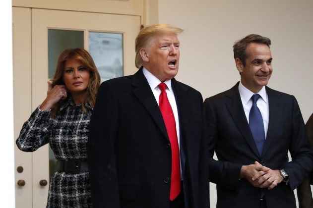 President Donald Trump, accompanied by first lady Melania Trump, talks on the Colonnade as he welcome Greek Prime Minister Kyriakos Mitsotakis at the White House, Tuesday, Jan. 7, 2020, in Washington. (AP Photo/Alex Brandon)