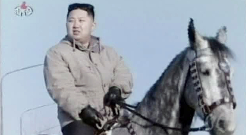 In this undated image made from KRT video, North Korea's new young leader Kim Jong Un rides a horse at an undisclosed place in North Korea, aired Sunday, Jan. 8, 2012. Kim Jong Un, who was named "supreme leader" of North Korea's people, ruling Workers' Party and military following the death last month of his father, Kim Jong Il, was shown observing firing exercises and posing for photographs with soldiers in footage that was shot before his father's death and aired as a documentary Sunday. (AP Photo/KRT via APTN) TV OUT, NORTH KOREA OUT