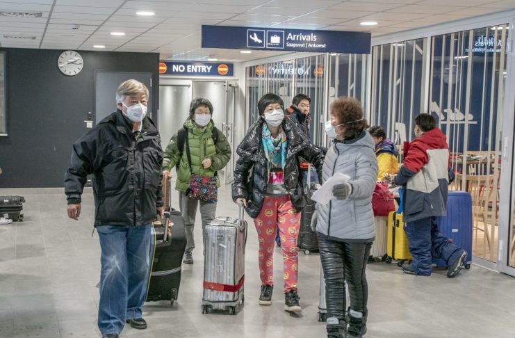 epa08185621 Tourists wearing face masks arrive to Lapland at Rovaniemi airport in Rovaniemi, Finland, 01 February 2020. The coronavirus, called 2019-nCoV, originating from Wuhan, China, has spread to all the 31 provinces of China and several countries in the world. The outbreak of coronavirus has so far claimed 259 lives and infected more than 11,000 others, according to media reports.  EPA/KAISA SIREN