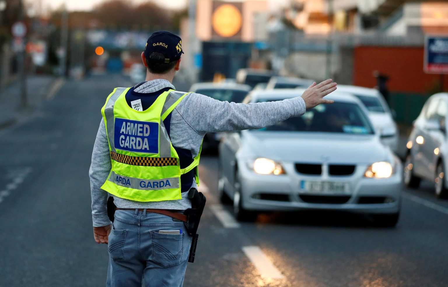FILE PHOTO: A police officer is seen on the streets of Dublin as the spread of the coronavirus disease (COVID-19) continues, Dublin, Ireland, March 29, 2020. REUTERS/Jason Cairnduff/File Photo