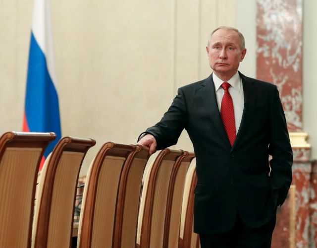 Russian President Vladimir Putin speaks with Prime Minister Dmitry Medvedev before a meeting with members of the government in Moscow, Russia January 15, 2020. Sputnik/Dmitry Astakhov/Pool via REUTERS  ATTENTION EDITORS - THIS IMAGE WAS PROVIDED BY A THIRD PARTY.