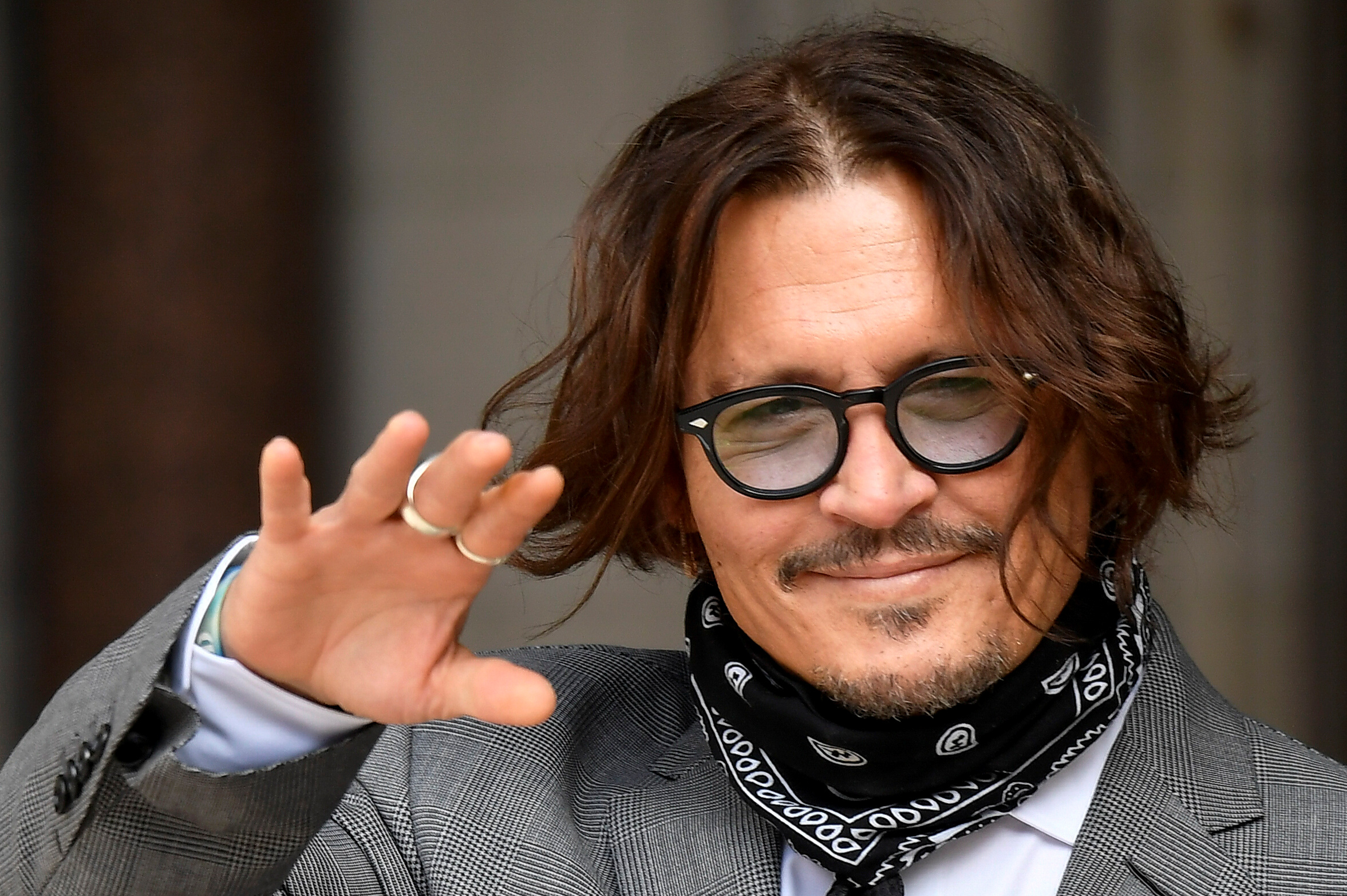 Actor Johnny Depp gestures as he arrives at the High Court in London, Britain July 13, 2020. REUTERS/Toby Melville