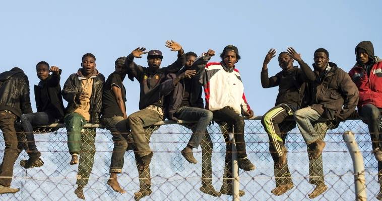 migrant-fence-morocco-immigrants