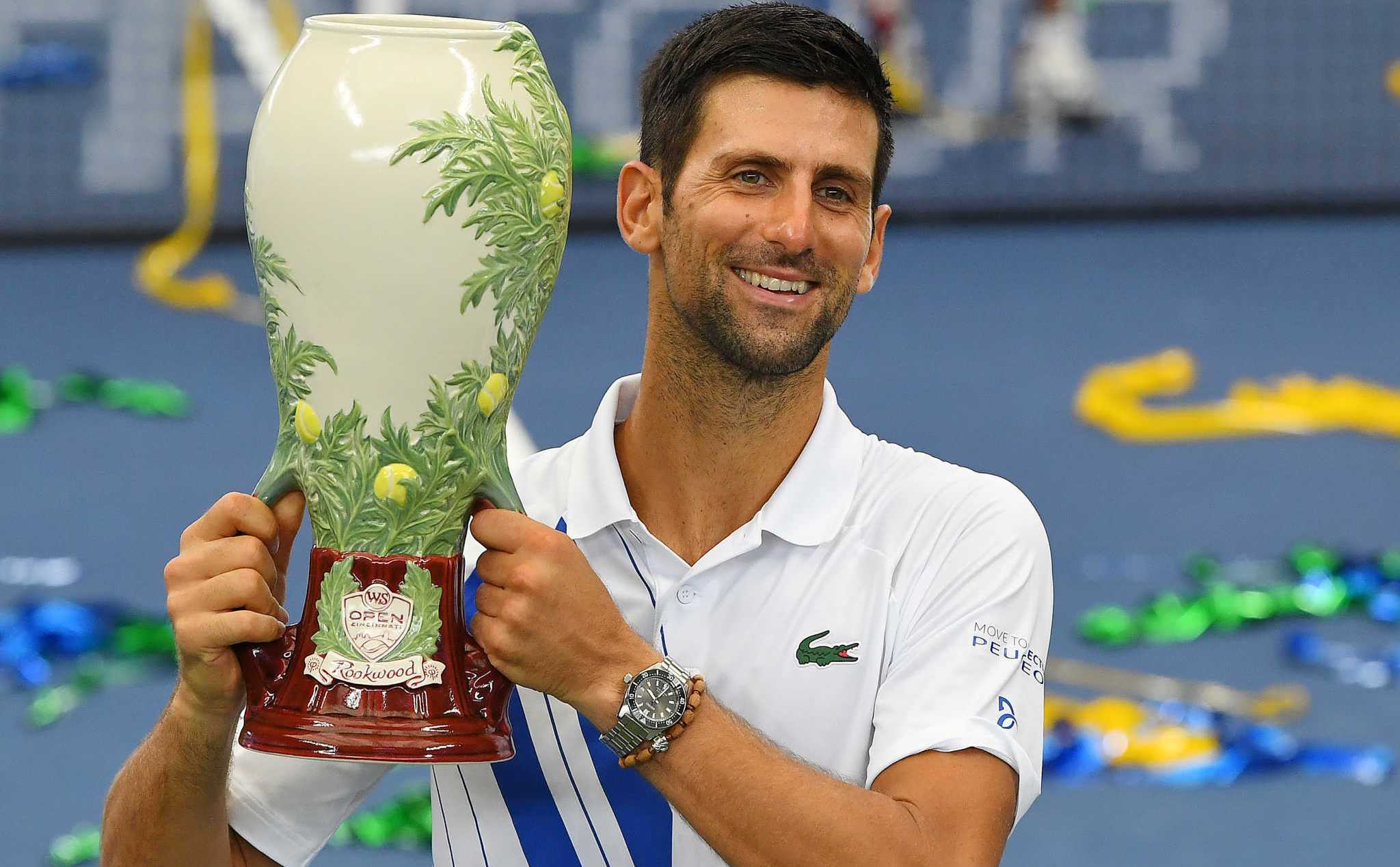 Aug 29, 2020; Flushing Meadows, New York, USA; Mens champion Novak Djokovic (SRB) poses with the trophy following his win over Milos Raonic (CAN) in the Western & Southern Open at the USTA Billie Jean King National Tennis Center. Mandatory Credit: Robert Deutsch-USA TODAY Sports