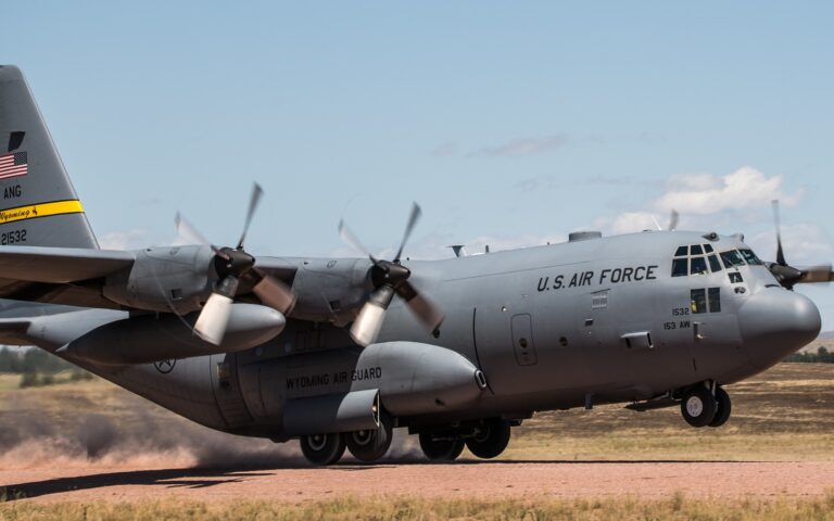 A C-130 Hercules with the 153rd Airlift Wing, Wyoming Air National Guard, lands on a tactical dirt strip during a training exercise with the 243rd Air Traffic Control Squadron on July 14, 2020 Camp Guernsey, Wyo. The 243rd ATCS is one of only ten Air National Guard Air Traffic Control Squadrons located throughout the United States. Their mission is to deploy and employ Air Traffic Control services worldwide and an important part of the Guard air traffic control mission includes establishing bases in locations without existing air traffic control facilities. (U.S. Air National Guard photo by Tech. Sgt. Jon Alderman)