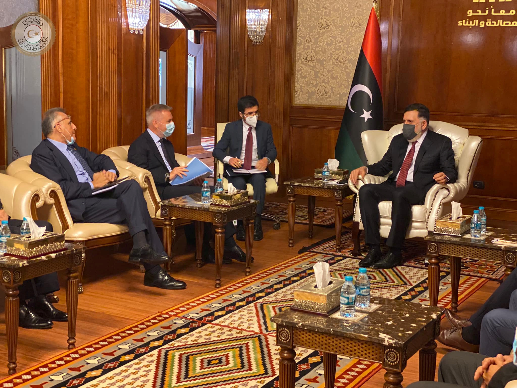 Libya's internationally recognised Prime Minister Fayez al-Sarraj wears a protective mask as he meets with Italian Defence Minister Lorenzo Guerini in Tripoli, Libya August 5, 2020. The Media Office of the Prime Minister/Handout via REUTERS ATTENTION EDITORS - THIS IMAGE WAS PROVIDED BY A THIRD PARTY.