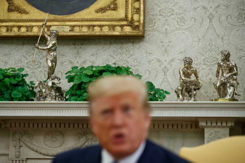 Statues of mythological figures are seen on the fireplace mantel behind President Donald Trump speaks during a meeting with Pakistani Prime Minister Imran Khan in the Oval Office of the White House, Monday, July 22, 2019, in Washington. (AP Photo/Alex Brandon)