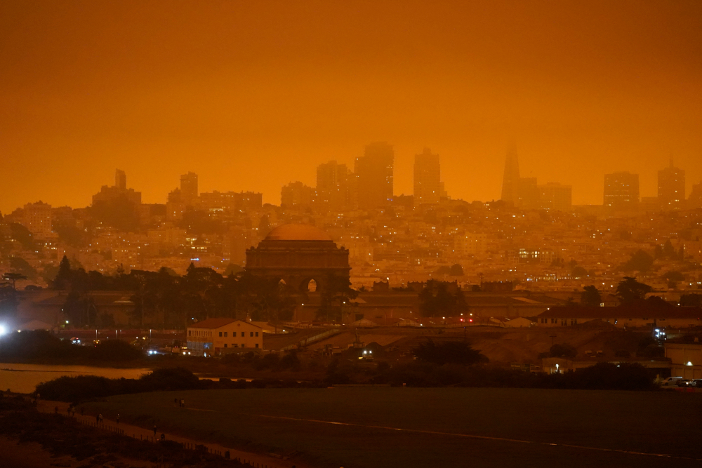The skyline in the distance behind Crissy Field is barely visible with smoke from wildfires late Wednesday morning, Sept. 9, 2020, in San Francisco. (AP Photo/Eric Risberg)