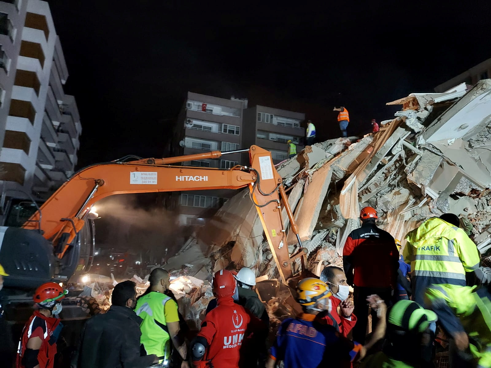Rescque teams search for survivors at a collapsed building after a strong earthquake struck the Aegean Sea where some buildings collapsed in the coastal province of Izmir, Turkey, October 30, 2020. REUTERS/Tuncay Dersinlioglu