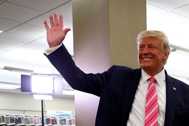 U.S. President Donald Trump waves after voting in the 2020 presidential election at the Palm Beach County Library in West Palm Beach, U.S., October 24, 2020. REUTERS/Tom Brenner