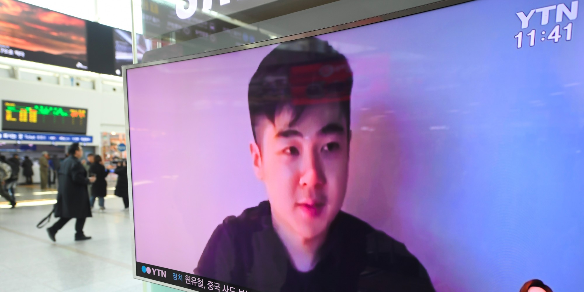 South Koreans watch a television news showing a video footage of a man who claims he is Kim Han-Sol, a nephew of North Korea's leader Kim Jong-Un, at a railway station in Seoul on March 8, 2017.
The video of a man describing himself as the son of assassinated North Korean exile Kim Jong-Nam emerged on March 8, apparently the first time a family member has spoken about the killing. / AFP PHOTO / JUNG Yeon-Je        (Photo credit should read JUNG YEON-JE/AFP/Getty Images)