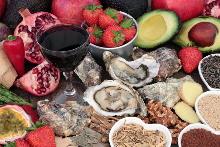 Aphrodisiac food and drink forming a background. Foods to promote sexual health.