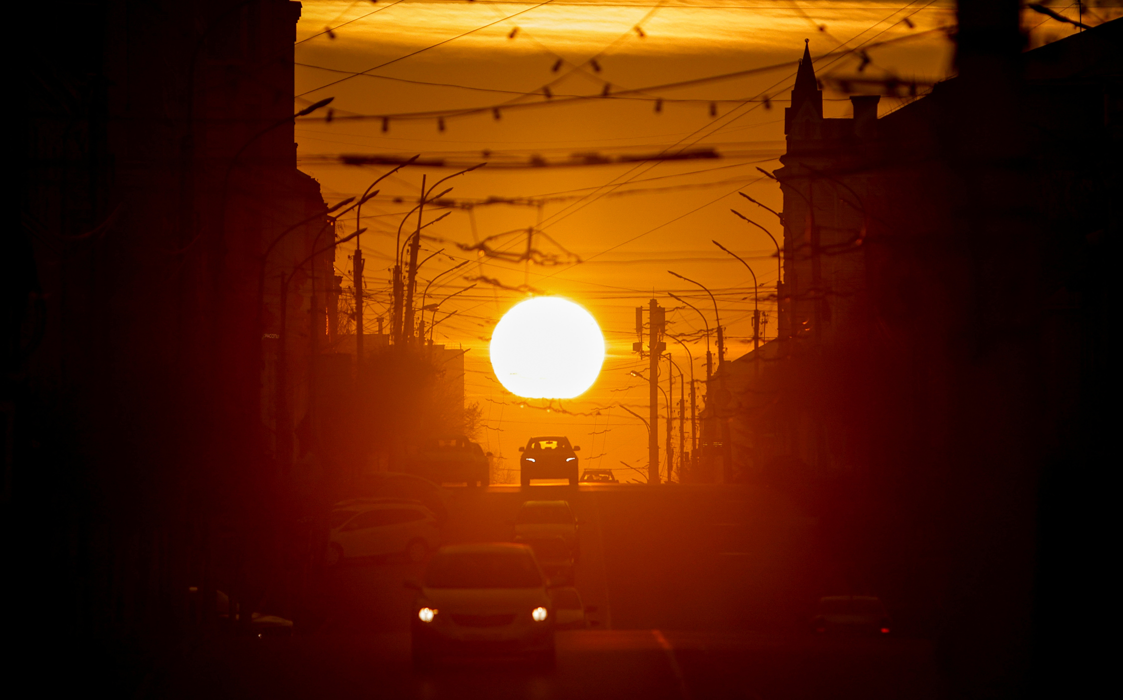 Cars drive along the street as the sun sets in Ryazan, Russia December 12, 2020. REUTERS/Maxim Shemetov