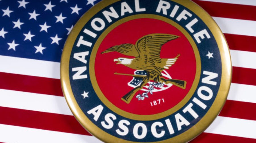LONDON, UK - MARCH 26TH 2018: The symbol of the National Rifle Association portrayed with the US flag, on 26th March 2018.
