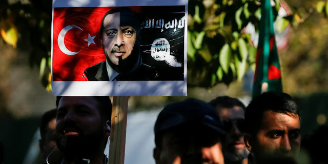 Protesters take part in a rally against the Turkish military operation in Syria, in front of the U.S. embassy in Kiev, Ukraine October 16, 2019. REUTERS/Gleb Garanich