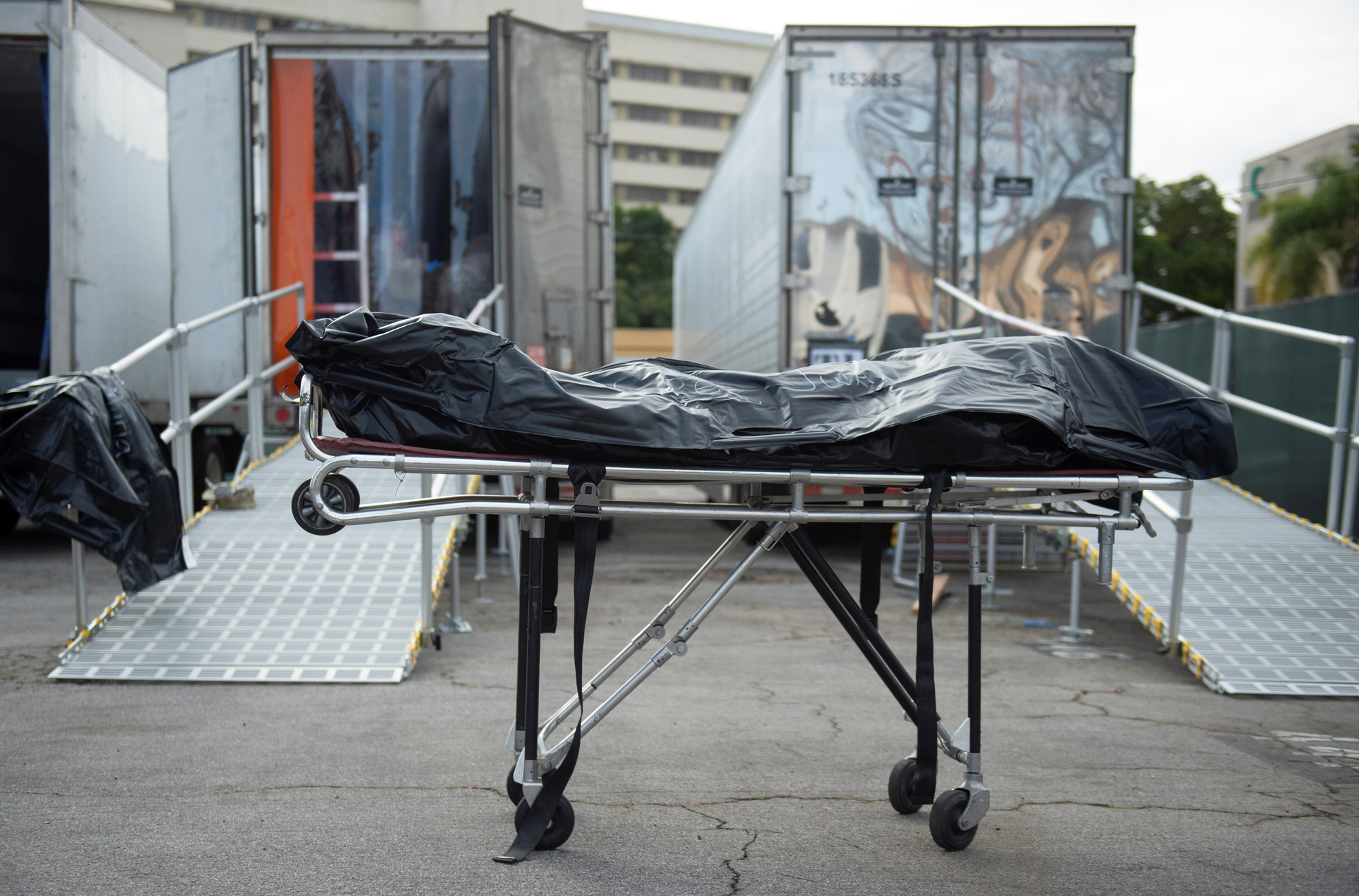 A deceased person lies on a gurney at an L.A. County Medical Examiner-Coroner (DEMC) secondary temporary refrigerated storage facility for coronavirus disease (COVID-19) decedents in Los Angeles, California, U.S. January 27, 2021. Picture taken January 27, 2021. County of Los Angeles/Handout via REUTERS. THIS IMAGE HAS BEEN SUPPLIED BY A THIRD PARTY.