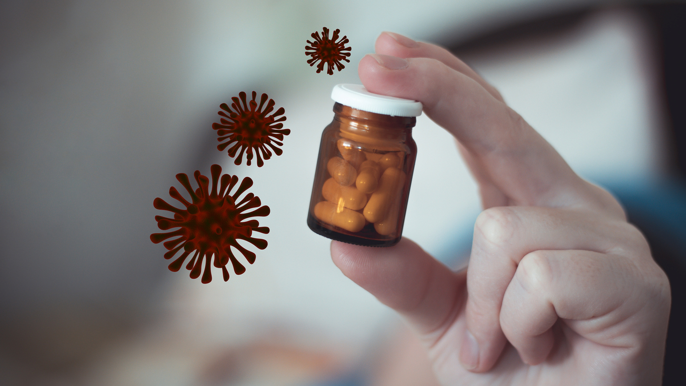 Small brown glass bottle with antibiotic pills in a female hand. The cure for the coronavirus influenza disease. 3d rendering dangerous flu strain cases