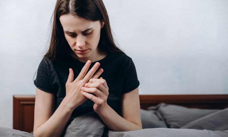 close-up-of-sad-tired-woman-suffering-from-pain-in-hand-or-wrist-on-picture-id1222612052-768x460