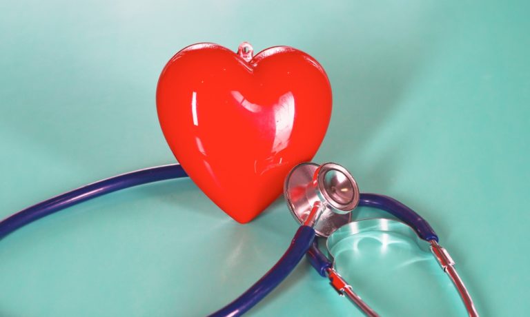 red-heart-with-stethoscope-on-blue-wooden-background-copy-space-day-picture-id962691568-768x460