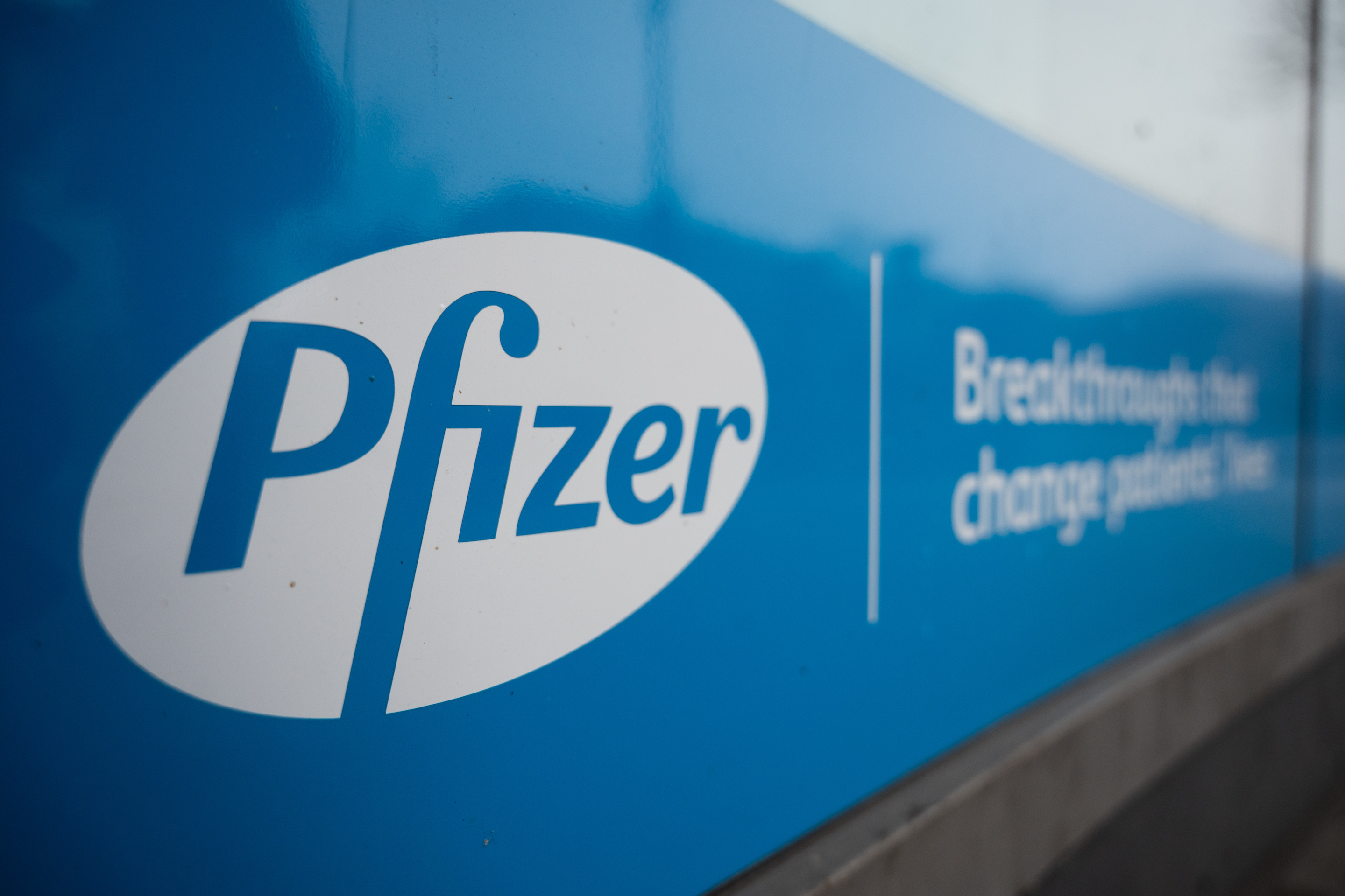 23 January 2021, Berlin: Pfizer's logo is displayed at one of its corporate offices. Since 2020, Pfizer has been working with the company Biontech on the development of a Covid 19 vaccine. Photo: Christophe Gateau/dpa (Photo by Christophe Gateau/picture alliance via Getty Images)