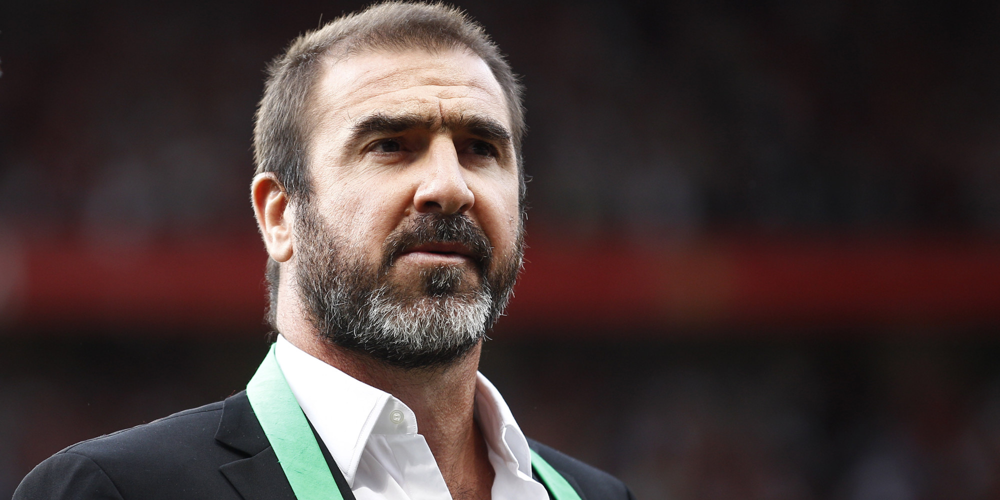 New York Cosmos manager Eric Cantona stands on the pitch before a testimonial soccer match for former Manchester United player Paul Scholes at Old Trafford Stadium, Manchester, England, Friday Aug. 5, 2011. (AP Photo/Jon Super) NO INTERNET/MOBILE USAGE WITHOUT FOOTBALL ASSOCIATION PREMIER LEAGUE(FAPL)LICENCE. EMAIL info@football-dataco.com FOR DETAILS.