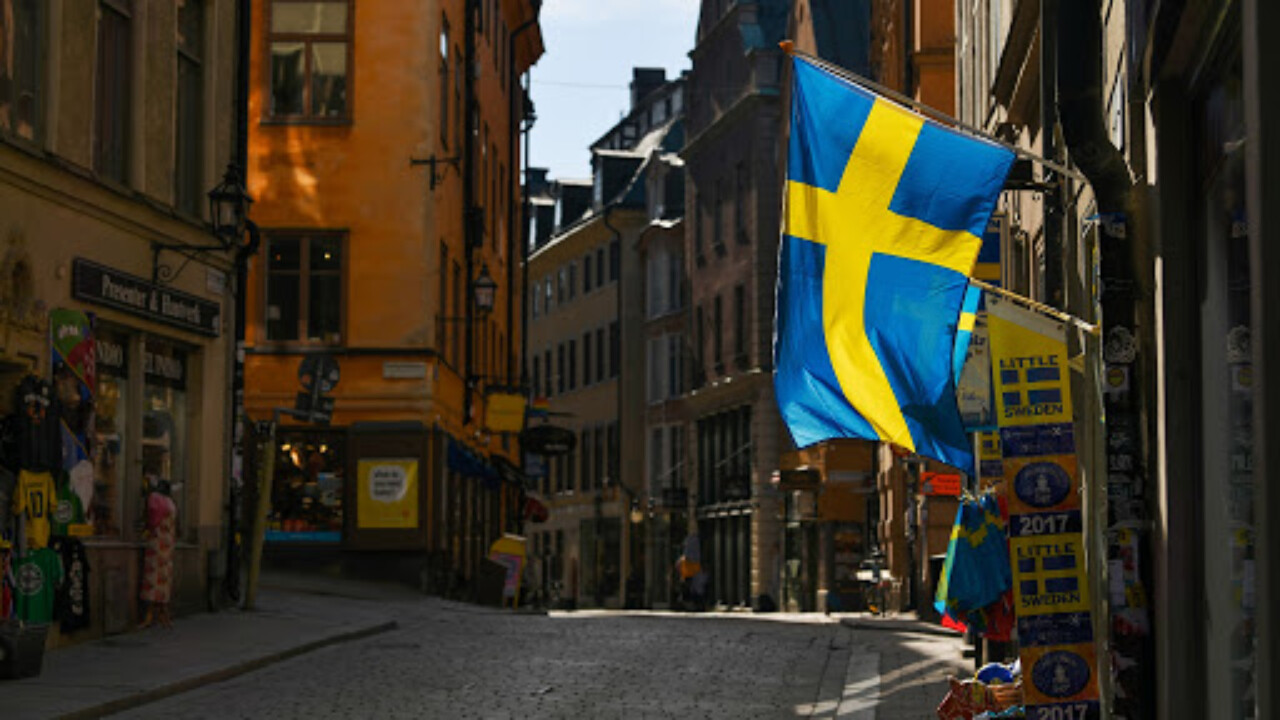 Swedish flags fly from a tourist souvenir shop in Gamla Stan in Stockholm, Sweden, on Thursday, March 26, 2020. Sweden is starting to look like a global outlier in its response to the coronavirus. Photographer: Mikael Sjoberg/Bloomberg