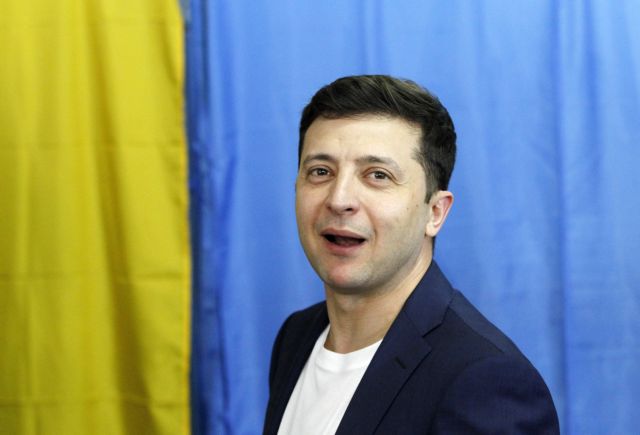 epa07519351 Ukrainian Presidential candidate Volodymyr Zelensky reacts at a polling station during Presidential elections in Kiev, Ukraine, 21 April 2019. Ukrainians vote in the second round of Presidential elections on 21 April 2019. After the first round of elections, showman Volodymyr Zelensky is a frontrunner with 30.24 percent of votes and incumbent president Petro Poroshenko is a runner-up with 15.95 percent of votes.  EPA/STEPAN FRANKO